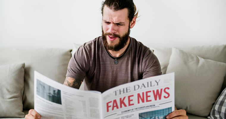 Man reading fake news